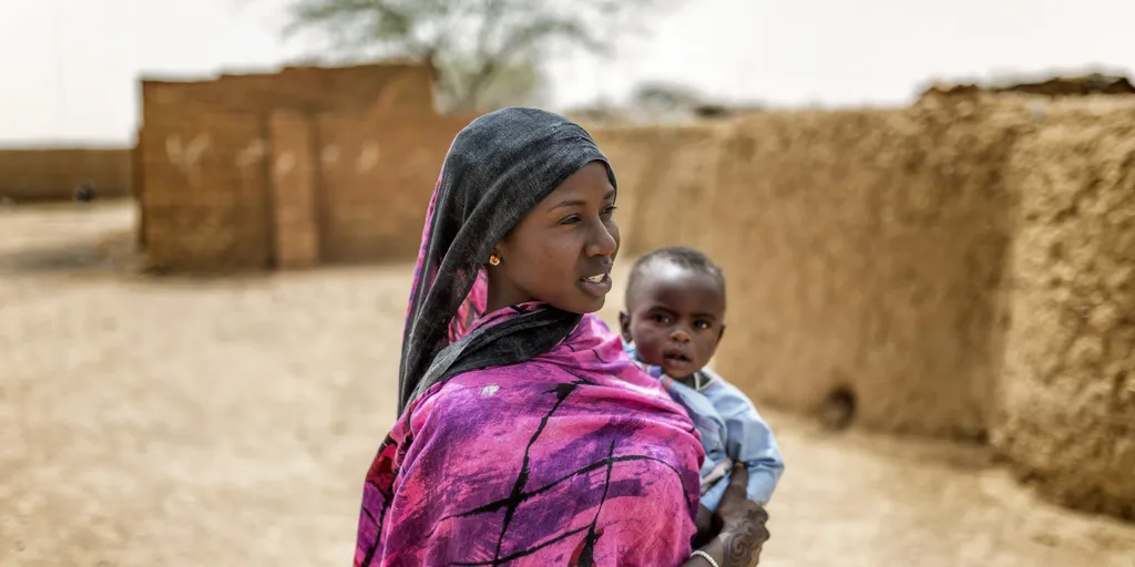 Djawahir, 24, and her 12-month-old baby boy Houssni live in Kounoungou refugee camp, eastern Chad, March 2021.